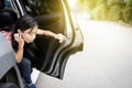 Unhappy asian child girl about to throw up from car sick or indigestion,female teenage vomiting in a car suffers from motion Royalty Free Stock Photo