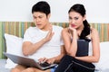 Unhappy Asian couple having issues surfing the internet Royalty Free Stock Photo