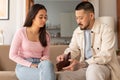 Unhappy Asian Couple Looking At Wallet Struggling Financial Issues Indoor Royalty Free Stock Photo