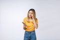 Unhappy Asian girl on the phone , Angry Asian woman talking phone with her boyfriend, isolated on white background. Royalty Free Stock Photo