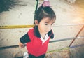 Unhappy asian girl looking aside while feeling sad at children p Royalty Free Stock Photo