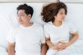 Unhappy Asian senior couple feel bad in bedroom. Royalty Free Stock Photo