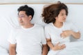 Unhappy Asian senior couple feel bad in bedroom. Royalty Free Stock Photo