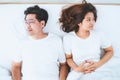 Unhappy Asian senior couple feel bad in bedroom. Royalty Free Stock Photo