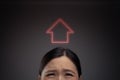 Unhappy Asian woman and home icon hologram effect