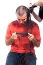 Unhappy bald man holding his long hair Royalty Free Stock Photo