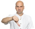Unhappy bald man showing thumbs down sign