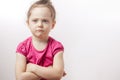 Unhappy beautiful ginger girl with crossed arms is expressing disagreement. body language