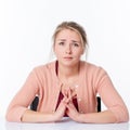 Unhappy beautiful young blond woman with sad looking eyes