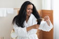 Unhappy Black Lady Brushing Detangling Hair With Hairbrush In Bathroom Royalty Free Stock Photo