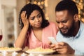 Unhappy Black Woman Bored On Date, Man Using Phone Royalty Free Stock Photo