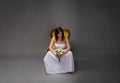 Unhappy bride sitting with bouquet on hand Royalty Free Stock Photo