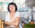 Unhappy brunette housewife Royalty Free Stock Photo