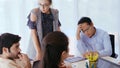 Unhappy business people in group meeting. Royalty Free Stock Photo