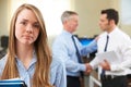 Unhappy Businesswoman With Male Colleague Being Congratulated Royalty Free Stock Photo