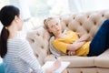 Unhappy cheerless woman looking at her therapist