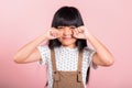 Asian little kid 10 years old bad mood her cry wipe tears with fingers Royalty Free Stock Photo