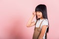 Asian little kid 10 years old bad mood her cry wipe tears with fingers Royalty Free Stock Photo