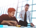 Unhappy Construction boss trying to fix problem in a team meeting