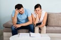 Unhappy Couple Calculating Bills Royalty Free Stock Photo