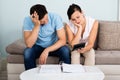 Unhappy Couple Calculating Bills Royalty Free Stock Photo