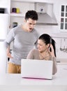 Unhappy couple in the kitchen