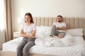 Unhappy couple with problems in relationship on bed Royalty Free Stock Photo