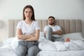 Unhappy couple with problems in relationship on bed Royalty Free Stock Photo