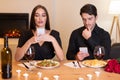 Unhappy Couple Using Mobile Phones Bored On Date Royalty Free Stock Photo