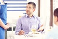 Unhappy customer in a restaurant Royalty Free Stock Photo