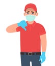 Unhappy delivery man or courier in mask and gloves showing thumbs down sign. Person gesturing dislike or bad. Male making negative