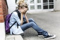 Unhappy Pre teen girl at school Royalty Free Stock Photo