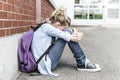 Unhappy Pre teen girl at school Royalty Free Stock Photo