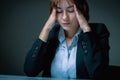 Unhappy and depressed business woman working overtime in office and having a headacheas if she want to say: I hate my work! Low Royalty Free Stock Photo