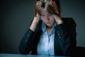 Unhappy and depressed business woman working overtime in office and having a headacheas if she want to say: I hate my work! Symbol Royalty Free Stock Photo