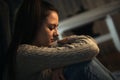 Depressed teenage girl sitting on floor alone, feeling lonely and misunderstood, stressed sad teenager thinking about Royalty Free Stock Photo