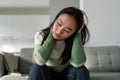 Unhappy depressed young Asian woman feeling sad and lonely after breakup or divorce