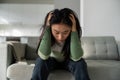 Unhappy depressed young Asian woman feeling sad and lonely after breakup or divorce