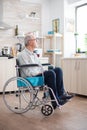 Unhappy disabled senior man sitting in wheelchair Royalty Free Stock Photo