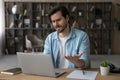 Unhappy dissatisfied businessman looking at laptop screen, reading bad news