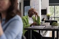 Unhappy employee having headache at work, professional burnout Royalty Free Stock Photo