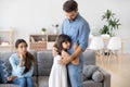 Unhappy family in living room daughter embrace father