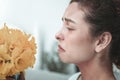 Woman after getting flowers from husband having allergy Royalty Free Stock Photo