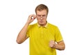 Unhappy geek guy in glasses and yellow T-shirt ready to fight with fists isolated white background Royalty Free Stock Photo