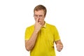 Unhappy geek guy in glasses and yellow T-shirt ready to fight with fists isolated white background Royalty Free Stock Photo