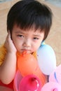 Unhappy girl with balloons