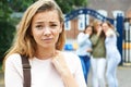 Unhappy Girl Being Gossiped About By School Friends Royalty Free Stock Photo