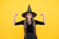 Unhappy girl ready to celebrate. costume party fun. happy halloween. powerful child in witch hat and glasses. kid goes Royalty Free Stock Photo