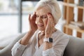 Unhappy gloomy woman having a headache