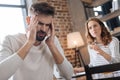 Unhappy handsome man holding his temples Royalty Free Stock Photo